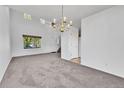 Spacious living room with high ceilings, ample natural light, and plush carpeting at 11963 Dahlia Dr, Thornton, CO 80233