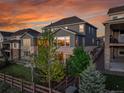 The back of the house features a mix of siding and stone at 8179 S Kellerman Cir, Aurora, CO 80016