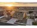 Beautiful single-Gathering home featuring solar panels, a two-car garage, a covered front porch and professional landscaping at 8751 S Wenatchee Ct, Aurora, CO 80016