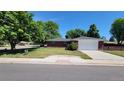 Ranch house with attached garage and neat landscaping at 2998 S York St, Denver, CO 80210