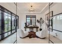 Bright and airy home office with glass walls and modern furniture at 521 Milwaukee St, Denver, CO 80206