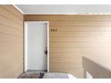 Condo entrance featuring unit number 302 with a white door and beige siding at 3041 S Ursula Cir # 302, Aurora, CO 80014