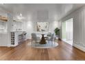 Elegant dining room with a marble-top table, seating for four, and a decorative area rug at 3131 E Alameda Ave # 1302, Denver, CO 80209