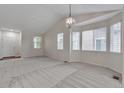 Bright and airy living room with vaulted ceilings and neutral carpet at 3678 Shadow Cir, Castle Rock, CO 80109