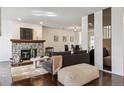 Inviting living room featuring a stone fireplace and dining room at 1390 S Idalia St # 39F, Aurora, CO 80017