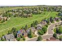 Picturesque aerial view of a suburban neighborhood with green spaces and walking path at 848 Huntington Pl, Highlands Ranch, CO 80126