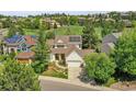 Charming two-story home with a well-maintained lawn and a solar panel, in a Gathering-friendly neighborhood at 848 Huntington Pl, Highlands Ranch, CO 80126