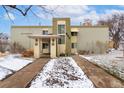 Apartment building featuring well-maintained landscaping and clearly marked address at 655 S Clinton St # 2A, Denver, CO 80247