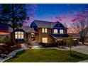 Charming two-story home features a manicured lawn, three car garage and tasteful landscaping at 2162 Terraridge Dr, Highlands Ranch, CO 80126