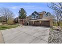 Charming two-story home with three car garage and well manicured lawn at 2162 Terraridge Dr, Highlands Ranch, CO 80126