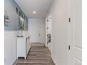 Bright entryway with modern flooring, leading to the rest of the home at 9835 Uravan St, Commerce City, CO 80022