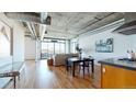 Open-concept living area showcasing the dining space, kitchen, and comfortable living room, perfect for entertaining at 1401 Wewatta St # 808, Denver, CO 80202