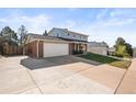 A two-story home featuring a spacious driveway, and a convenient two-car garage at 9940 Pecos St, Thornton, CO 80260