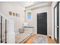Inviting entryway with a decorative ceiling, comfortable seating, and stylish accents, creating a warm welcome at 2470 Robindale Way, Castle Rock, CO 80109
