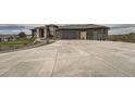 Stunning home displaying modern architecture, a wide driveway, and well-manicured front yard at 10689 Shadow Pines Rd, Parker, CO 80138