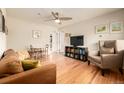 Inviting living room features hardwood floors, a ceiling fan, and comfortable seating arrangement at 1800 Grove St, Denver, CO 80204