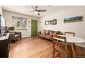 Cozy living room with hardwood floors, ceiling fan, and a leather sofa at 1800 Grove St, Denver, CO 80204