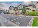 Well-maintained condo complex showcases reserved parking and mature landscaping at 8757 E Dry Creek Rd # 1528, Englewood, CO 80112