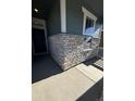 Stone and siding exterior detail of the home's entrance at 5124 N Quemoy St, Aurora, CO 80019