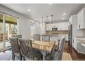Sunlit dining area with modern furnishings, perfect for Gathering meals and gatherings at 14881 Chicago St, Parker, CO 80134