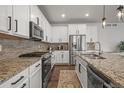 Kitchen with stainless steel appliances and granite countertops at 14881 Chicago St, Parker, CO 80134