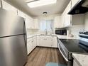 Clean kitchen featuring white cabinets, stainless steel appliances, and modern countertops at 8625 Clay St # 228, Westminster, CO 80031