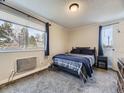 Comfortable bedroom with natural light, featuring a cozy bed, and warm colors at 2280 S Oswego Way # 104, Aurora, CO 80014