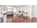Spacious living room featuring hardwood floors, neutral walls and an open floor plan at 5530 Lewiston Ct, Denver, CO 80239