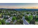 Beautiful community featuring lush greenery and stunning mountain views at 6973 Daventry Pl, Castle Pines, CO 80108