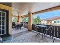 Inviting covered patio with dining and lounge spaces, ideal for entertaining guests or relaxing at 9836 W Freiburg Dr # 4E, Littleton, CO 80127