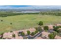 Townhomes with easy access to water and green space and snow-capped mountains in the distance at 4603 S Abilene Cir, Aurora, CO 80015