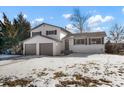 Newly remodeled two-car garage and spacious front yard at 6190 W Canyon Ave, Littleton, CO 80128