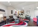 Cozy living room with hardwood floors, open to kitchen area at 875 E 78Th Ave # 7, Denver, CO 80229