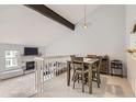Bright dining area featuring hardwood floors, open floor plan, and easy access to the living room with fireplace at 7640 S Monaco W Cir, Centennial, CO 80112