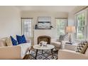 Bright living room with stylish furniture, hardwood floors, and a decorative fireplace at 2634 S Humboldt St, Denver, CO 80210