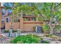 Exterior of home with mature trees and manicured rock landscaping at 8747 Mesquite Row, Lone Tree, CO 80124