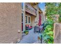 Outdoor patio with dining set, seating, and lush plant life at 8747 Mesquite Row, Lone Tree, CO 80124