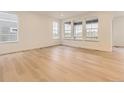 Bright, open living room featuring hardwood floors and large windows at 10736 Snowdon St, Parker, CO 80134