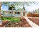 Charming single-story home featuring a well-maintained lawn, shutters, and inviting curb appeal at 1892 S Fairfax St, Denver, CO 80222