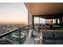 Relax on this expansive outdoor balcony with mountain and city views, including a grill and dining set at 1133 14Th St # 3430, Denver, CO 80202