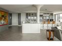 Modern kitchen featuring white cabinets, granite countertops, and breakfast bar at 1133 14Th St # 3430, Denver, CO 80202