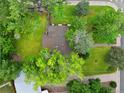 Aerial view of the property showcasing a well-maintained yard and mature trees at 2680 S Garfield Cir, Denver, CO 80210