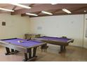 Well-lit recreation room with pool table and foosball at 7455 E Quincy Ave # 204, Denver, CO 80237