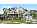 Charming two-story house showcasing impeccable landscaping, stone details, and a spacious three-car garage at 22263 Boundstone St, Parker, CO 80138