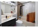 Stylish bathroom featuring modern fixtures, a sleek vanity, and a tiled shower/tub combination with an overhead rain shower at 613 N Brentwood Ct, Castle Rock, CO 80104