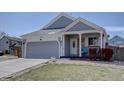Charming single-Gathering home with a two-car garage, covered porch, and well-maintained landscaping at 4361 Kirk Ct, Denver, CO 80249