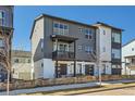 Modern two-story home with eye-catching curb appeal and a small, cozy balcony at 2052 Alcott Way, Broomfield, CO 80023