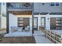 Inviting front porch with stylish seating and a cozy ambiance for relaxing outdoors at 2052 Alcott Way, Broomfield, CO 80023