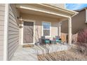 Inviting covered front porch with seating area, perfect for relaxing and enjoying the outdoors at 1628 Taos St, Brighton, CO 80603