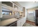 This kitchen has great countertops, flooring and lighting at 7700 W Glasgow Pl # 19C, Littleton, CO 80128